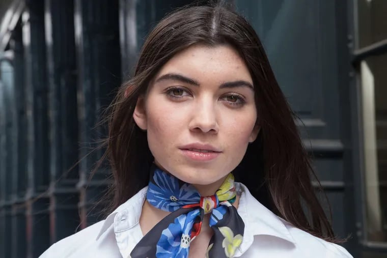 Model Kathryn Brooks wearing a scarf in a springtime pattern.