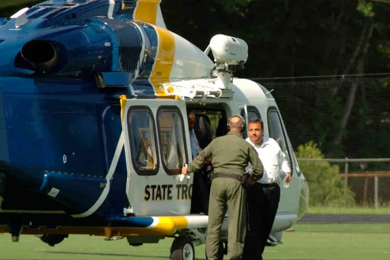 Gov. Christie arrives via state police helicopter in Montvale, N.J., to watch his son play baseball in high school playoffs. Christie left the game Tuesday to meet Iowa fund-raisers. Critics blasted him as an elitist hypocrite.