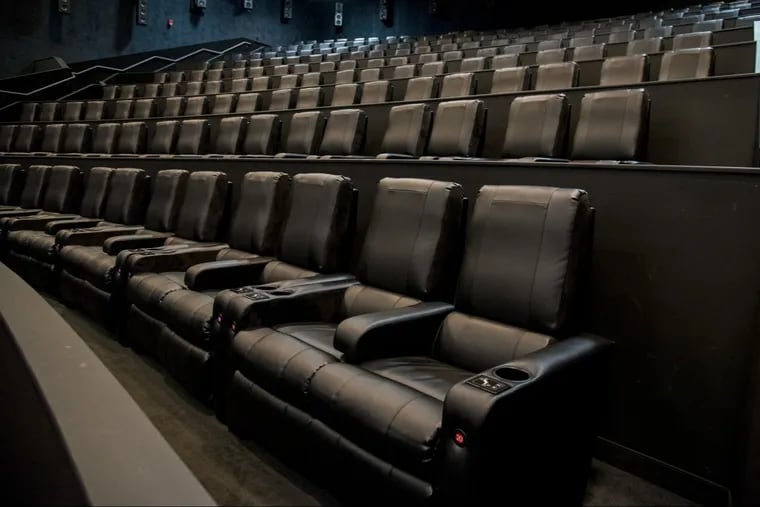 The interior of the Dolby Cinema in the Neshaminy Mall. The sound system has speakers throughout the theater, two laser projectors providing vivid colors and reclining seats that vibrate in sync with the action on the screen.