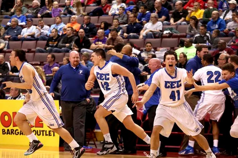 Chase Kumor, Vinny Dalessandro and Sean Kelly ( L - R ) celebrate a 62-51 win after a PIAA Class AA Final Conwell-Egan vs. Aliquippa at Giant Center in Hershey, Pa. Saturday March 21, 2015. ( DAVID SWANSON / Staff Photographer )