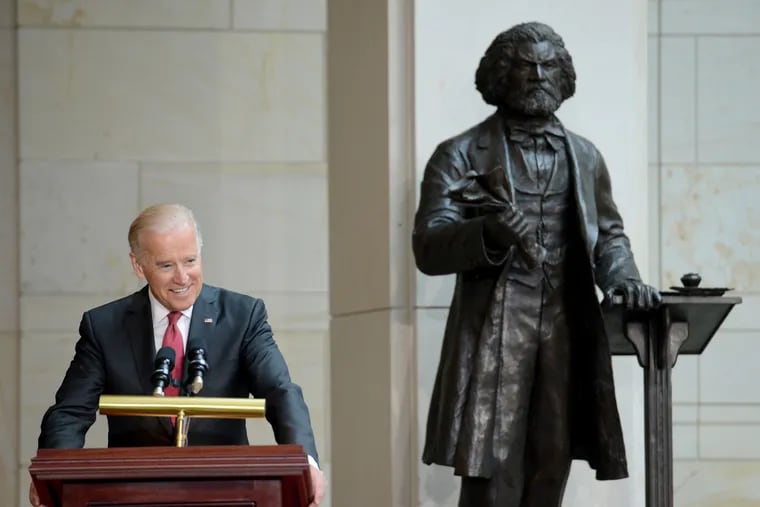 Joe Biden, then vice president, speaks at the 2013 dedication ceremony of Steven Weitzman's Frederick Douglass statue in the U.S. Capitol's Emancipation Hall.