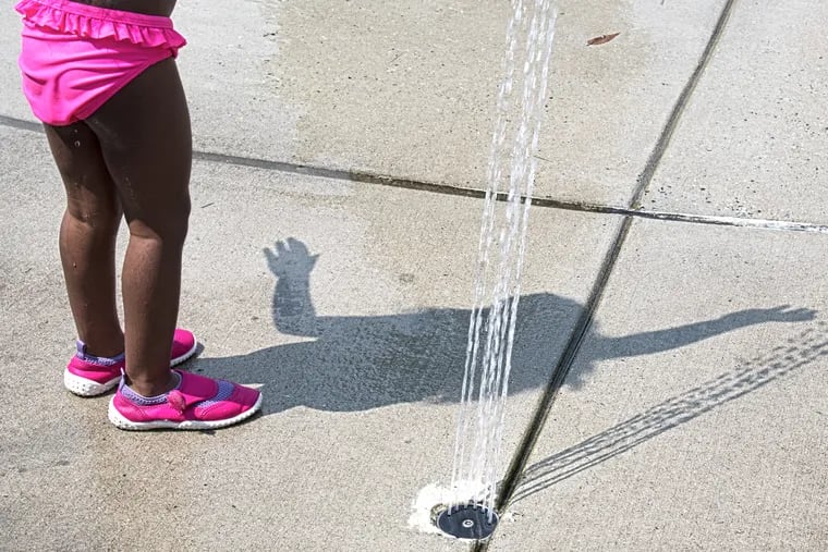 Savannah Guyapersaud, age-3, cools off from the August heat at Junod Park in the Northeast.