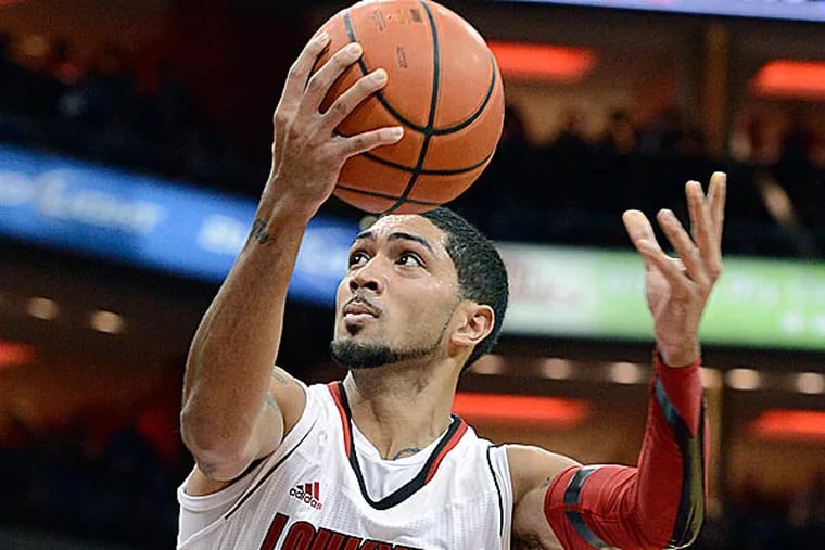 On Tuesday, the Sixers brought in Temple's Scootie Randall, Louisville's Peyton Siva (pictured), and Kentucky's Archie Goodwin. The workout was unannounced. (Timothy D. Easley/AP)