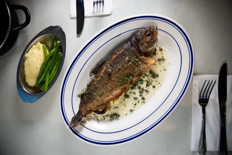 The whole rainbow trout in lemon-caper butter, served with a side of green beans and pureed potatoes at Gabi.