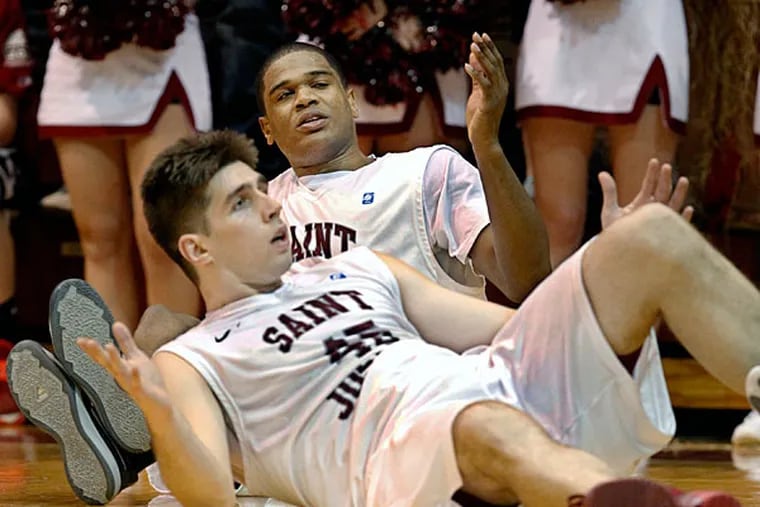 St. Joe's Halil Kanacevic and Ronald Roberts Jr. look for help from the official. (Ron Cortes/Staff Photographer)