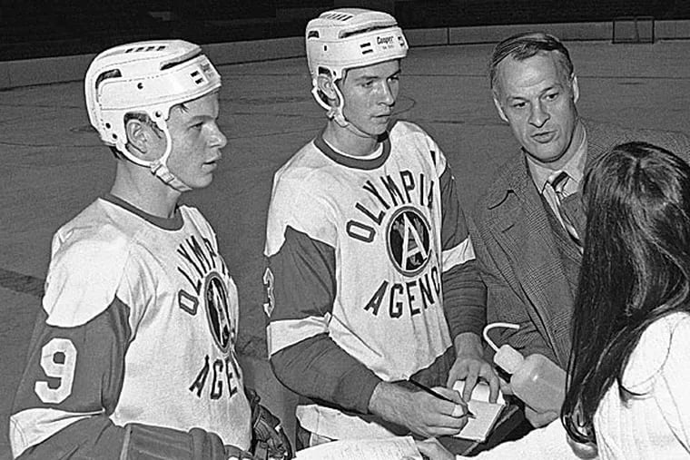 Gordie Howe with his sons Marty (left) and Mark. (AP photo)