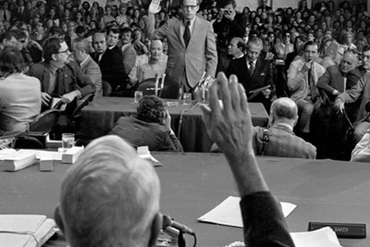 Former White House aide John Dean III is sworn in by Senate Watergate Committee Chairman Sam Ervin, D-N.C. in this June 25, 1973 file photo. (AP Photo/File)