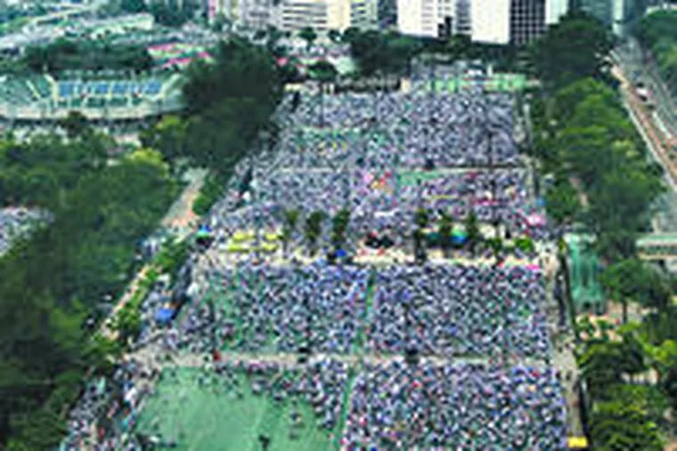 Hong Kong was returned to Chinese rule10 years ago today. On the anniversary in 2004, thousands marched for democracy.
