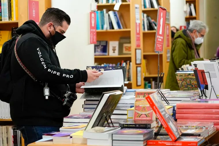 Customers browse while shopping for books at the Strand Bookstore in New York.