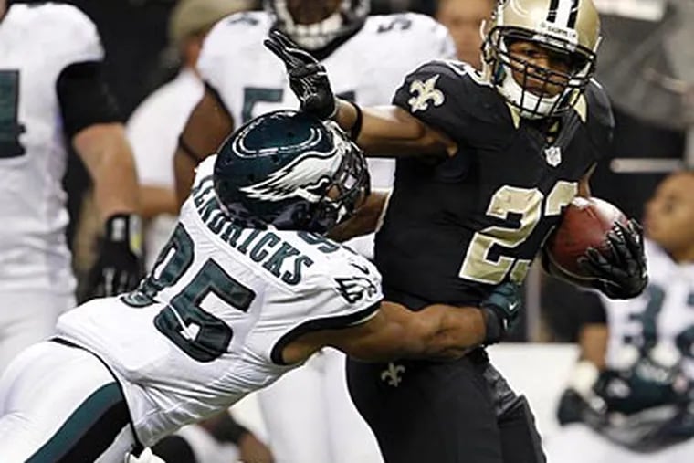 Eagles linebacker Mychal Kendricks gets shoved by the New Orleans Saints' Pierre Thomas. (Yong Kim/Staff Photographer)
