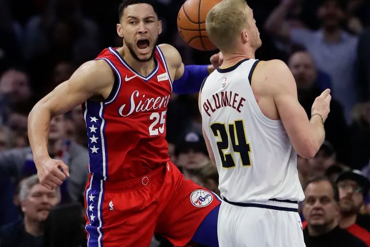 Sixers guard Ben Simmons yells after dunk on Denver Nuggets forward Mason Plumlee during the fourth-quarter of Friday's win.  Simmonds got fouled on the play.
