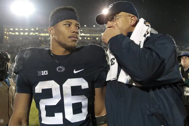 Former Penn State star running back Saquon Barkley talks with PSU head coach James Franklin during his time with the Nittany Lions. On Monday, Barkley agreed to a deal with the Eagles.