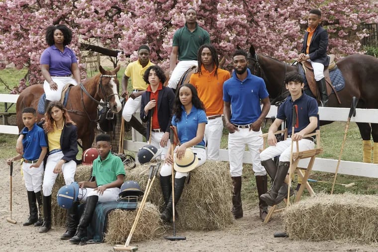Students and alumni from Work to Ride pose for Polo Ralph Lauren at the Chamounix Equestrian Center in Fairmount Park.