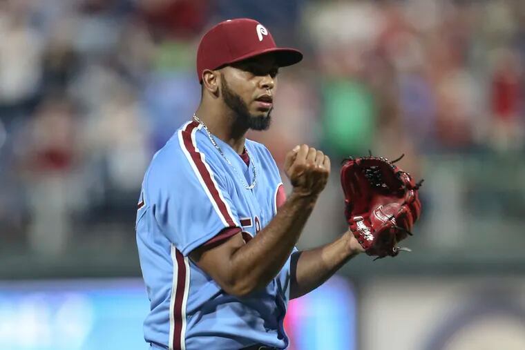 Philadelphia Phillies pitcher Seranthony Dominguez celebrates striking out the Washington Nationals' Wilmer Difo to end Thursday night's game at Citizens Bank Park.