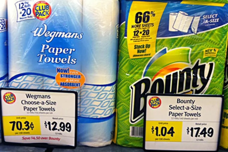 Paper towels at Wegmans in Collegeville. Grocery chains are replacing big brands with private-label products at a stunning clip. MARIA PANARITIS / Staff