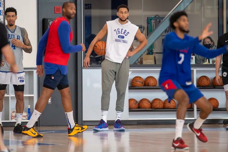 Ben Simmons, center, looks on during practice on Monday, Oct. 18, 2021., at the Seventy Sixers Practice Facility in Camden, N.J.