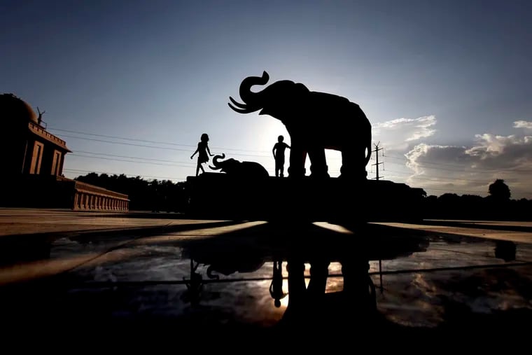 Indian children play next to an elephant statue at Ambedkar Park, dedicated to Dalits or India’s low-castes, which was opened to the public in Noida, on the outskirts of New Delhi, India. Dalit engineers and advocates say that tech companies don't understand caste bias and have not explicitly prohibited caste-based discrimination.
