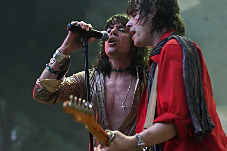 Keith Call (left) does his Mick Jagger while Glimmer Twins bandmate Bernie Bollendorf (right) does Keith Richards during their Rolling Stones tribute band performance at the Pennypack Park Music Festival. They've been playing the free, summerlong, all tribute band festival for six years, attracting thousands of fans to the Ed Kelly Amphitheater on the banks of Pennypack Creek.  (Photo by LoRusso Studios)