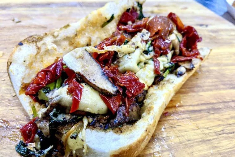 Portabello Slammer, with aged balsamic, aioli, sun-dried tomatoes, peppers, broccoli rabe, and mushrooms.
