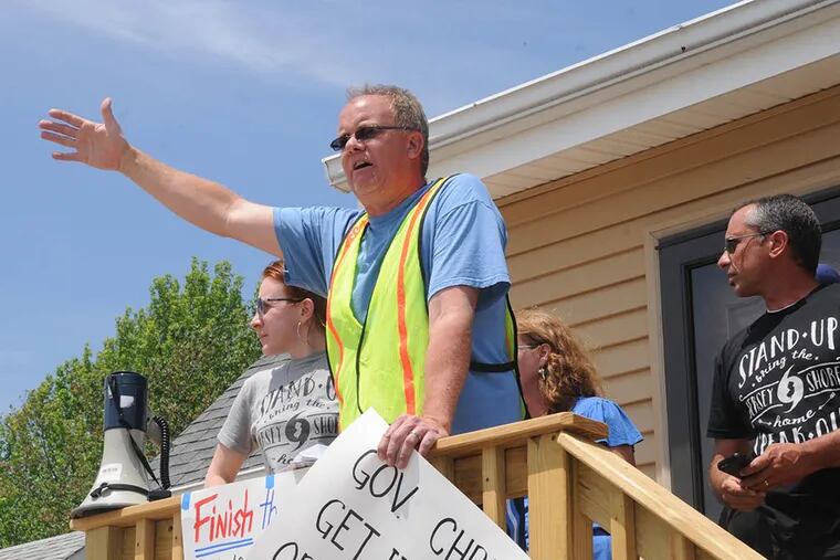 Chuck Atkinson, of West Beach Haven, N.J., addresses the many supporters that arrived at Joe Mangino's home during a Hurricane Sandy homeowners awareness rally on May 28, 2015. (Dave Griffin/For The Inquirer)