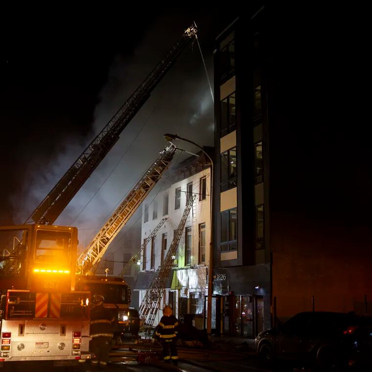 Firefighters work to put out a two-alarm fire on Ridge Avenue near 16th Street in Philadelphia, Pa. People were evacuated from the building and the neighboring building. No one was injured.