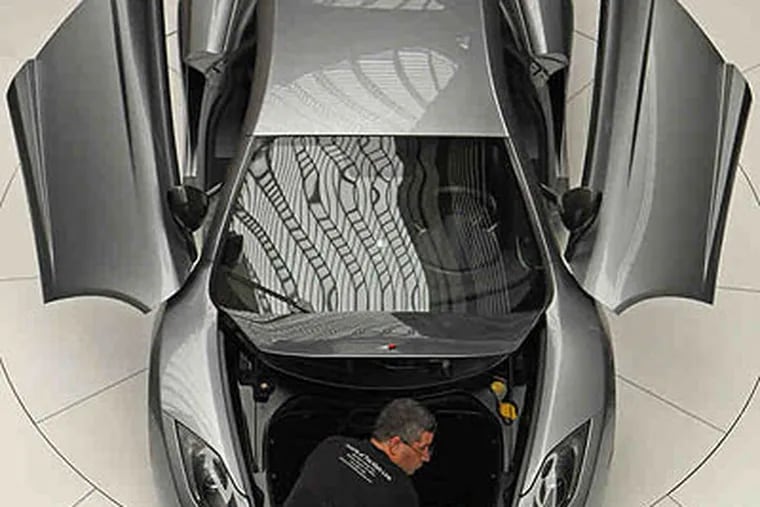 The new super-sleek McLaren MP4-12C super car can be yours for a cool $229,000, giving you a muscle machine that can go from 0 to 60 m.p.h. in about 3.2 seconds.  (Michael Bryant / Staff Photographer)