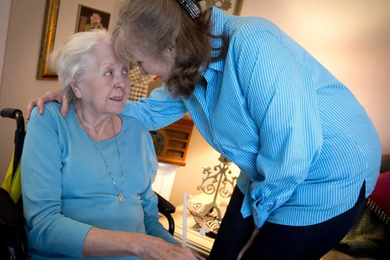 Barrie Page Hill, right, shares a moment with her mother Bobbie Wilburn, 79, in Arlington, Texas. Wilburn, who developed Alzheimer&#039;s disease, moved in with Hill.