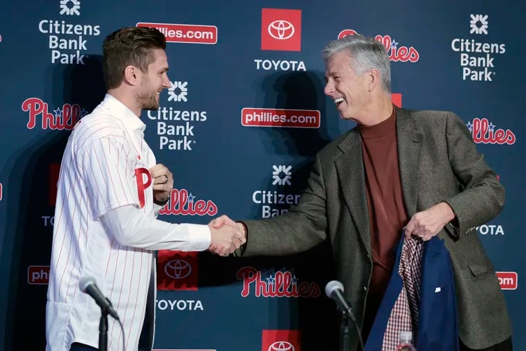 New Phillies shortstop Trea Turner and president of baseball operations Dave Dombrowski shake hands during Thursday's news conference at Citizens Bank Park.
