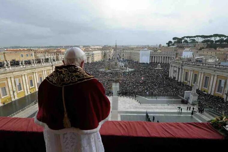 Pope Benedict XVI delivering his &quot;Urbi et Orbi&quot; message from the central balcony of St. Peter's Basilica. He prayed for Catholics in China who have risked government persecution.