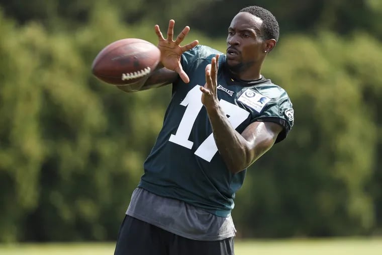 The Eagles’ Alshon Jeffery catches a ball during training camp on Wednesday. He was held out of further drills.