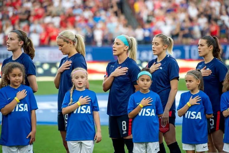 United States players Tierna Davidson, Lindsey Horan, Julie Ertz, Abby Dahlkemper, and Kelley O'Hara stand with their jerseys turned inside out during the playing of the national anthem before Wednesday's SheBelieves Cup game against Japan in Frisco, Texas.