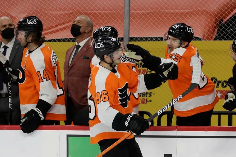 Second-year left winger Joel Farabee (86), one of the Flyers' few bright spots this season, celebrated his 20th goal with teammate James van Riemsdyk on May 10.