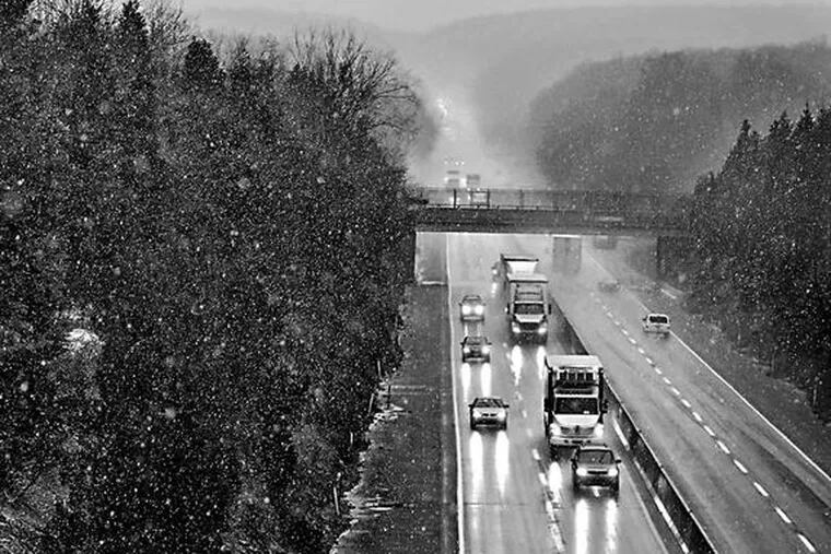 Southbound traffic cut through the gloom yesterday on the Northeast Extension of the Pennsylvania Turnpike, south of Quakertown - the far northern suburbs, where snow is always more likely. Even there, the odds for a white Christmas aren&#0039;t great. Story, B2.