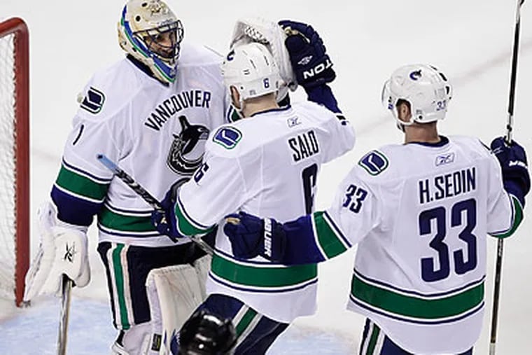 The Vancouver Canucks have a 3-1 series lead over the San Jose Sharks in the Western Conference Finals. (Paul Sakuma/AP)