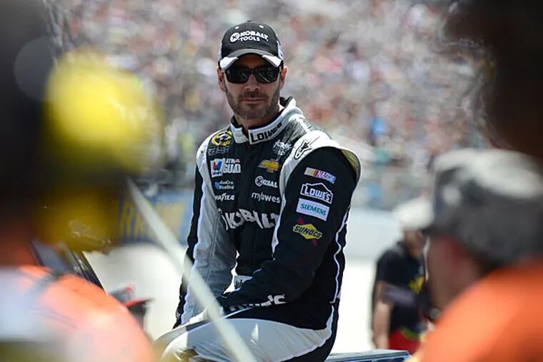 Jimmie Johnson arrives to the pit area before the NASCAR Sprint Cup series auto race, Sunday, June 1, 2014, at Dover International Speedway in Dover, Del. (Molly Riley/AP)