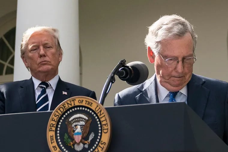Senate Majority Leader Mitch McConnell (R-Ky.) with then-President Donald Trump (left) in the Rose Garden after a meeting at the White House on Oct. 16, 2017.
