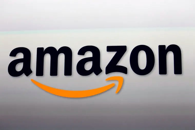 This Sept. 6, 2012 file photo shows the Amazon logo in Santa Monica, Calif. Nike is ending a sales partnership with Amazon less than a month after the athletic gear company named e-commerce veteran John Donahoe as its new CEO. (AP Photo/Reed Saxon, File)