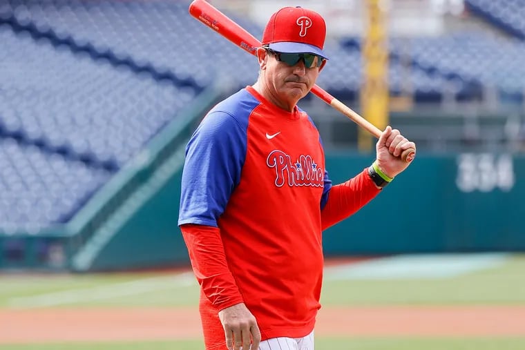 Interim manager Rob Thomson walks the field during warmups before the Phillies played the Los Angeles Angels on Friday.