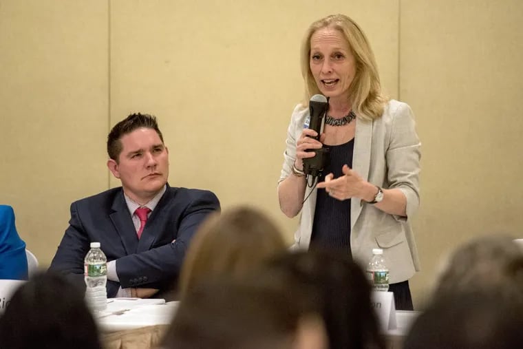 Mary Gay Scanlon, a candidate in the Democratic primary in the Fifth Congressional District speaks at a recent debate. Rival Rich Lazer is seated at left.