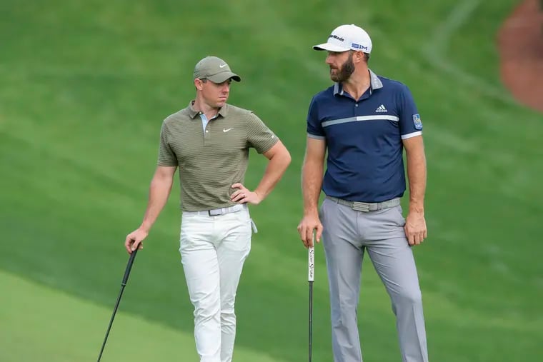 PGA Tour defender Rory McIlroy, left, and reigning LIV Golf champion Dustin Johnson waiting to hit their next shots at the 2020 Masters. LIV reportedly has lost a second ruling in two months.