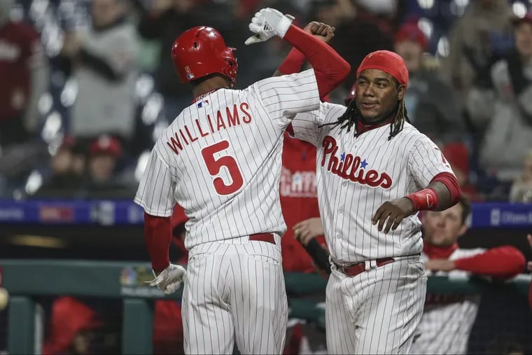 Nick Williams celebrates his eighth-inning solo homer with teammate Maikel Franco. The pinch-hit shot proved to be the difference in the Phillies 6-5 win.