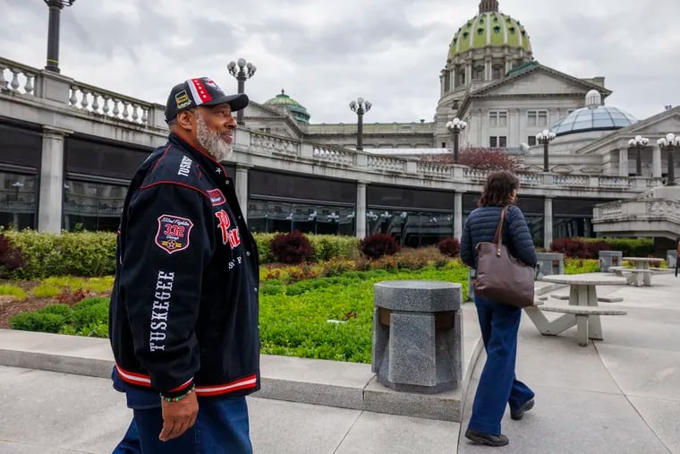 Douglas Paige, a veteran and retired Amtrack police officer, arrives at the Pennsylvania State Capitol to lobby lawmakers on May 1.
