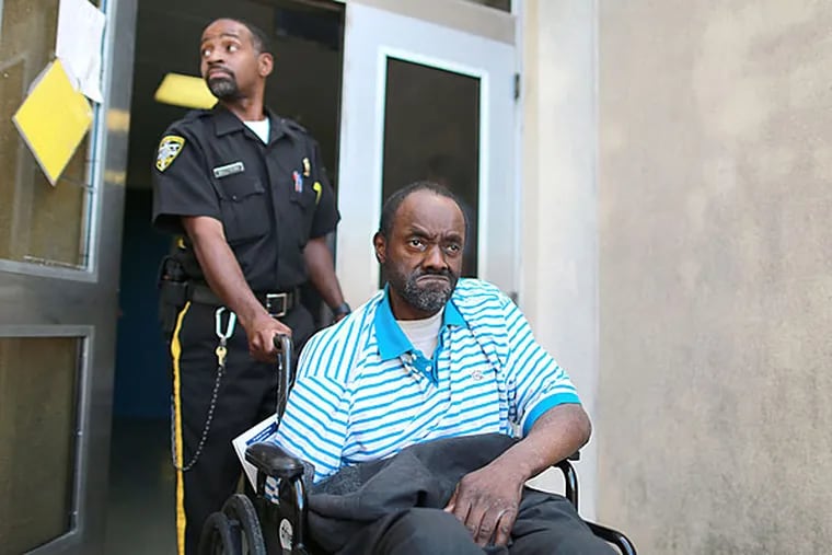 Marvae Dunn is wheeled to a waiting ambulance Monday morning. He's headed to a nursing home near Harrisburg. (David Swanson/Staff)