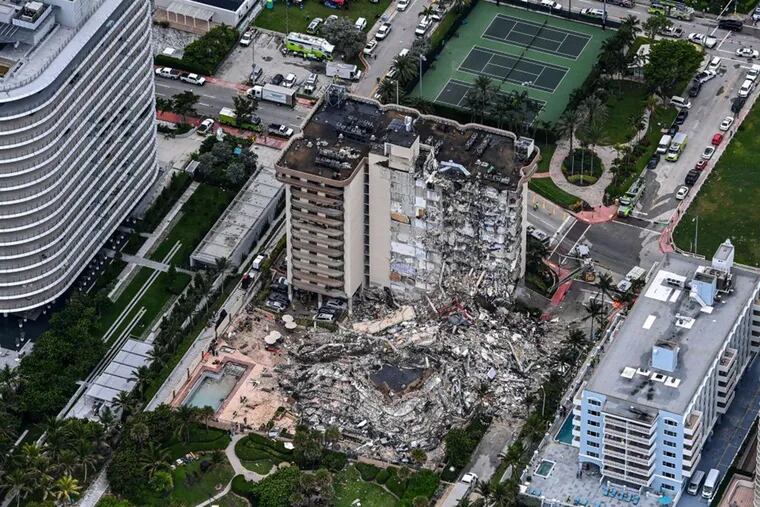 This aerial view, shows search and rescue personnel working on site after the partial collapse of the Champlain Towers South in Surfside, north of Miami Beach, on June 24, 2021.