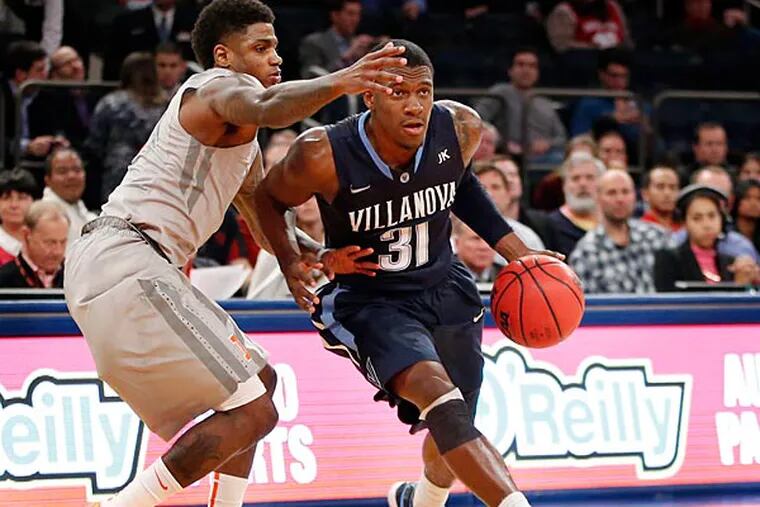 Illinois guard Aaron Cosby, left, defends Villanova guard Dylan Ennis
(31) in the second half of an NCAA basketball game at Madison Square
Garden in New York, Tuesday, Dec. 9, 2014. Ennis, with 18  points, was
the high scorer in Villanova's victory 73-59 over Illinois. (Kathy Willens/AP)