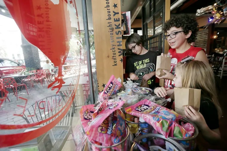 L-R Marley McGlinchey, 9, Luke Conneen, 10 and Aria Licidonio, 5, (all from Logan Twp) pick out penny candy while dining at The Red Hen of Swedesboro, NJ on June 28, 2018. The Red Hen of Swedesboro, NJ was mistaken by many to be the Red Hen of Virginia that kicked out Sarah Huckabee Sanders.