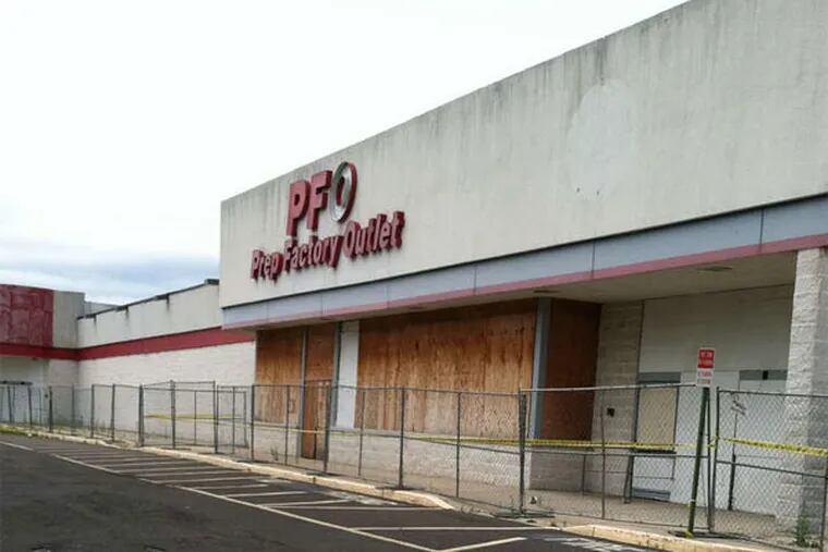 This dilapidated strip shopping center in Hamilton Township is the proposed site for the Walmart. (Jane M. Von Bergen / Staff)