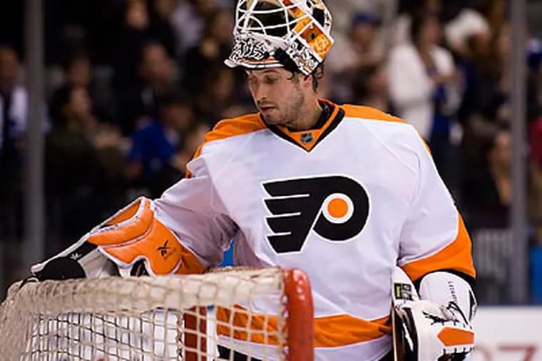 Michael Leighton will be out for at least a month because of a bulging disk in his back. (Adrien Veczan/Canadian Press/AP)