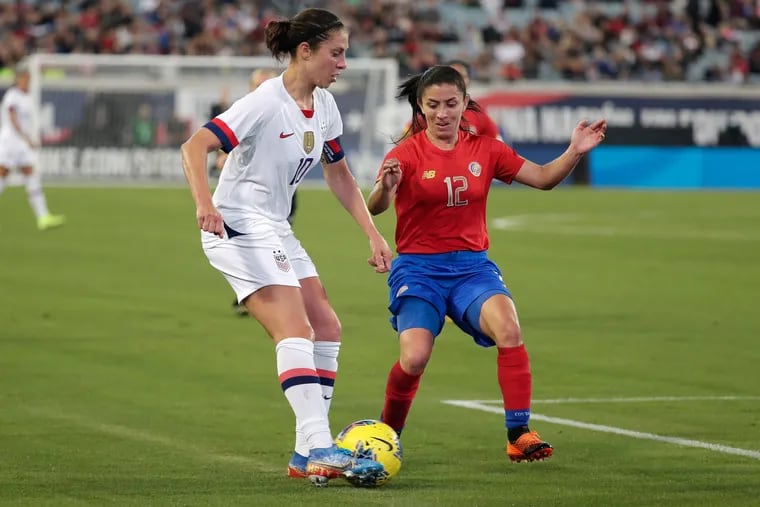 Delran native Carli Lloyd (left) on the ball during the first half.