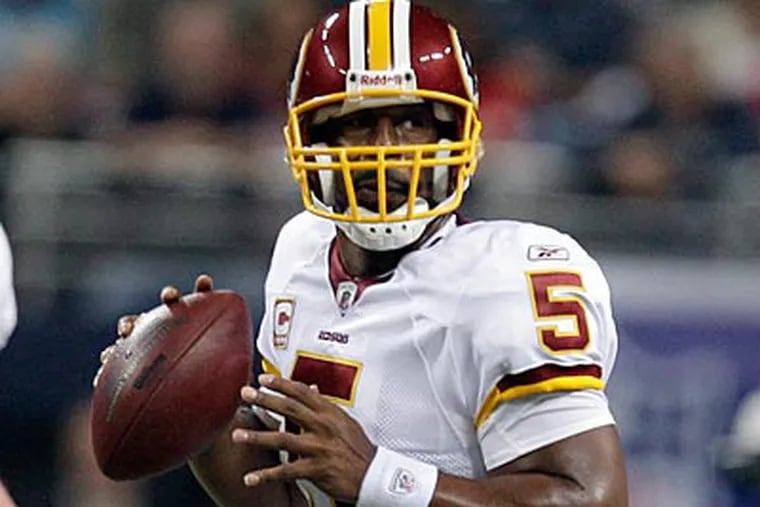 Donovan McNabb and the Redskins fell to the St. Louis Rams, 30-16, yesterday. (AP Photo/Jeff Roberson)